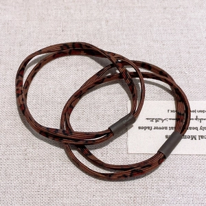Detail shot of high-elasticity hair ties featuring a stylish leopard pattern print