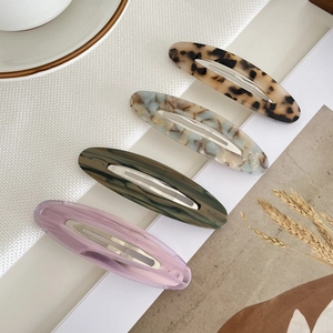Lot de 4 barrettes ovales en acétate, coloris écaille, marbre et teintes unies