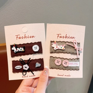 Detailed set of cute cartoon hair clips with puppy and bow designs for girls