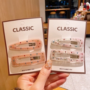 Elegantes Haarspangen-Set aus rosa Acetat mit bunten Strasssteinen in geometrischen Formen