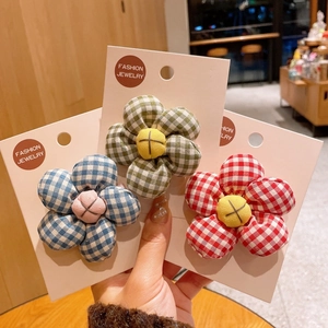 Three-pack of cute gingham fabric sunflower hair clips for girls in blue green and red