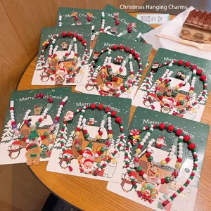 Set di gioielli natalizi per bambini con collana di perline e motivi a cartoni
