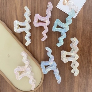 Iridescent oversized wave hair claw clips in assorted pastel colors for women