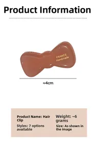 Detail view of a 4cm brown acetate bow hair clip with France Handmade gold engraving