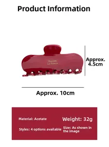 Detail view of a dark red acetate hair claw clip with size dimensions 10cm x 4.5cm