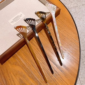 Elegant acetate hair sticks set with hollow fan design and pearl accents in vintage style
