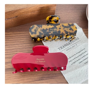 French retro acetate hair claws in leopard tortoiseshell and glossy deep red finish