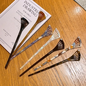 Elegant acetate fishtail hair sticks with pearl accents in various vintage marbled patterns