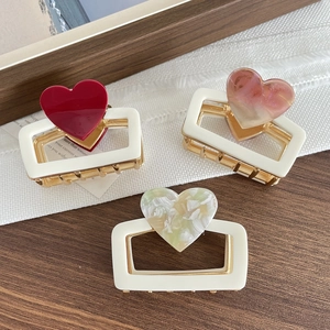 Three-piece set of elegant heart-shaped shark clips in red and marble patterns
