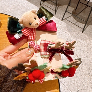 Christmas hair clip set featuring plush bear, reindeer antlers, and festive velvet bows