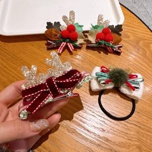 Detailed set of Christmas hair accessories with velvet bows and sequined reindeer antlers