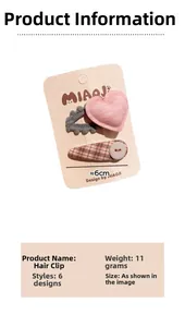 Détail du lot de barrettes à cheveux avec cœur rose et motifs en peluche gris