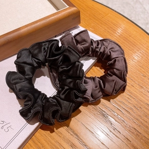 Elegant satin ruffle scrunchies set in black and brown colors for ponytail hair styling