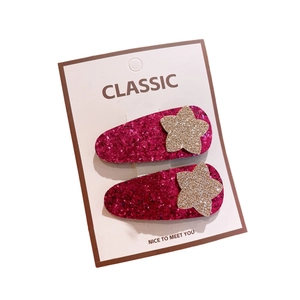 Barrettes à paillettes rose fuchsia avec étoiles dorées pour petites filles sur carte