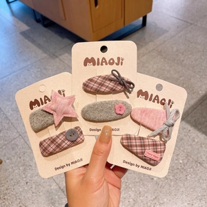 Gros plan de barrettes à cheveux en tissu fait main et épingles étoile en lot de 6