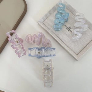 Large wavy acetate claw clips in multiple pastel colors for thick long hair styling