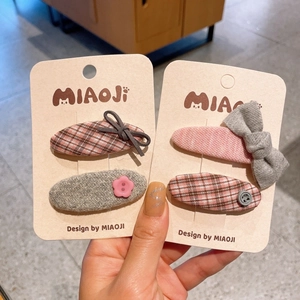 Lot de quatre barrettes à cheveux en tissu pour filles avec nœuds roses et gris chic