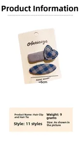 Detail of blue plaid heart hair clip and grey fabric snap barrette on card