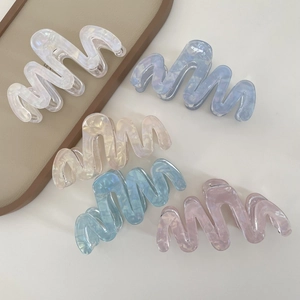 Large wavy acetate claw clip set in pearlescent pastel colors for long hair