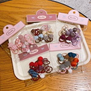 Set of cute plaid and floral scrunchies with elastic bands in colorful assorted patterns