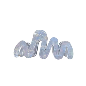 Iridescent wave-shaped acetate hair claw clip with holographic shell texture and sturdy grip