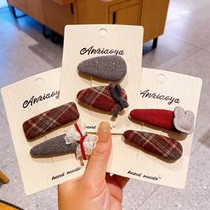 Detail of Korean style fabric bow hair clips with cute rabbit and lace accents on cards