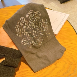 Elastic grey fabric headband featuring a colorful rhinestone hibiscus flower pattern