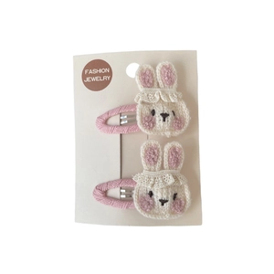 Barrettes à cheveux lapin tricotées pour filles avec fil rose et blanc sur carte