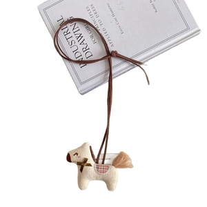 Cute cream plush horse pendant with brown bow and pink checkered saddle on neck strap