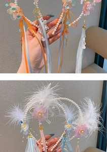 Detail van Hanfu haarband met zijden bloemblaadjes, lange kwastjes, parels en goud