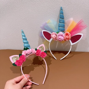 Detailed view of unicorn headbands with colorful sequins, silk flowers and tulle lace