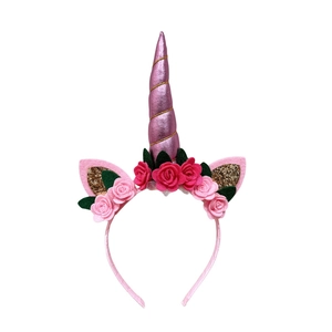 Pink unicorn headband with metallic horn and glittery cat ears for birthday parties