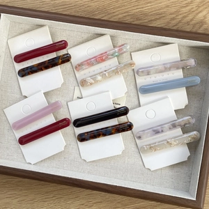 Detailed set of French acetate hair clips in assorted floral and marble patterns