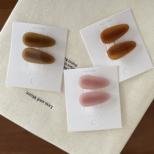Three sets of matte water drop hair clips in olive green, amber, and light pink colors