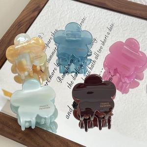 Floral acetate hair claws in pastel colors with glossy marble finish and handmade quality