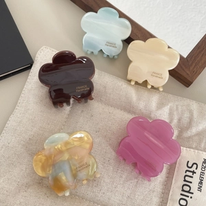 Set of five handmade acetate flower hair claws in assorted pastel candy colors for women