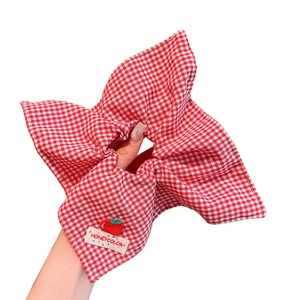 Classic red and white checkered fabric scrunchie with cute apple embroidery detail