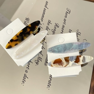 Set of 4 acetate tortoise shell hair clips in marble and pearlescent patterns