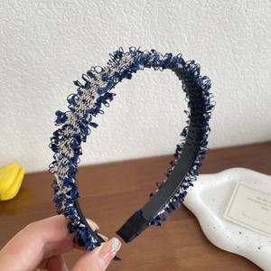 Blue and white tweed braided headband with fringed edges and anti-slip teeth design