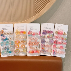 Détail de cinq lots de barrettes en résine thème océan avec sirènes et étoiles de mer