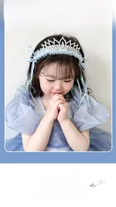 Detail of blue organza princess crown headband with rhinestones and ribbon tassels