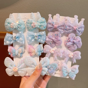 Detail of sweet macaron lace bows and cartoon rabbit hair clips for girls
