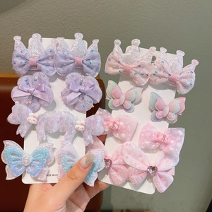 Cute girls hair clip set featuring lace bows and 3D floral designs on a display card