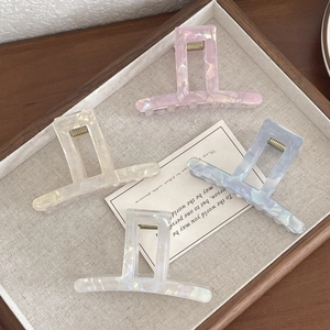 Set of four pastel geometric hair claws in pink cream blue and white with pearlescent finish