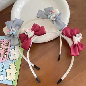 Set di cerchietti per bambini con fiocchi in tessuto e decorazioni unicorno in resina