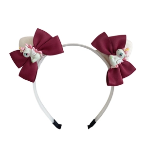 Cerchietto bianco per bambini con fiocchi bordeaux e ciondoli a forma di unicorno