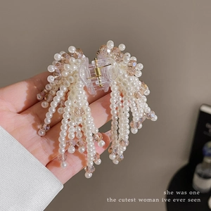Elegant pearl and crystal beaded hair claw clip for women featuring champagne tassels