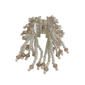 Elegant pearl tassel hair claw clip with crystal beads for a sophisticated half-up hairstyle