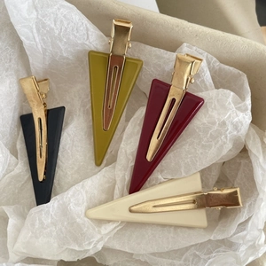 Set of four minimalist triangular acetate hair clips in black, green, burgundy and beige