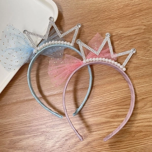 Close-up of handmade princess crown headbands with sequins, rhinestones and pearls